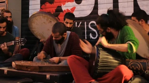 Group of street musicians playing on Istiklal Street in Istanbul Stock Footage