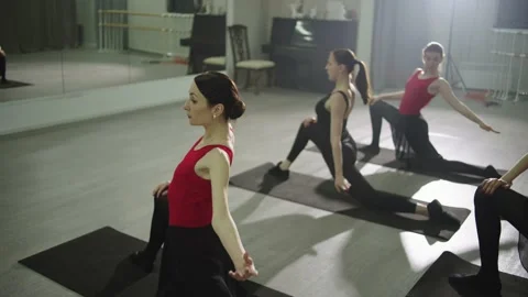 Group stretching class using ballet techniques. Stock Footage 239629990