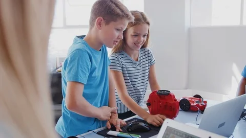 Group Of Students In After School Computer Coding Class Learning To Program Stock Footage 111933192