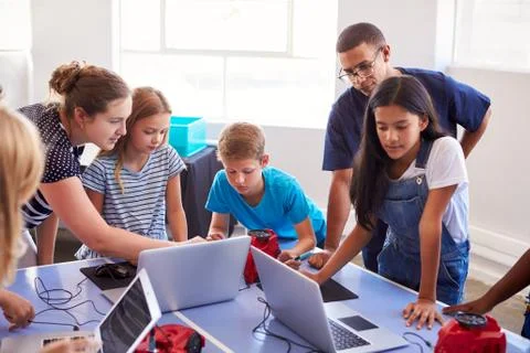 Group Of Students In After School Computer Coding Class Learning To Program Stock Photos