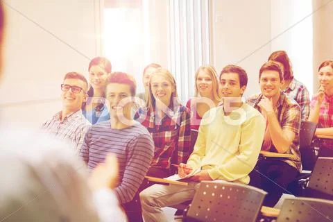 Group of students and teacher with notebook Stock Photos