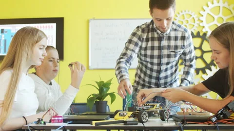 Group of students and teacher in robotics club Stock Footage 140758882