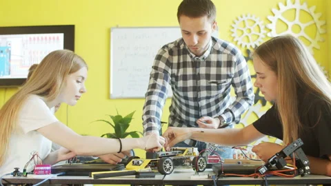 Group of students and teacher in robotics club Stock Footage 140761399