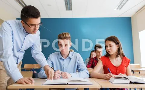 Group of students and teacher at school classroom Stock Photos