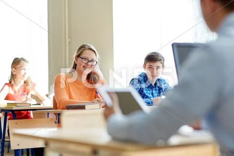 Group of students with books writing school test Stock Photos