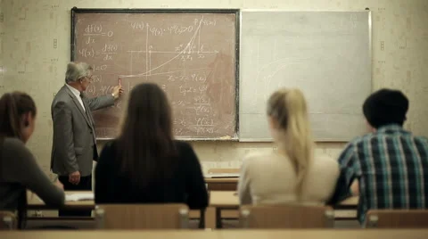 Group of students in a classroom, listening as their teacher holds a lecture. Stock Footage 44236107