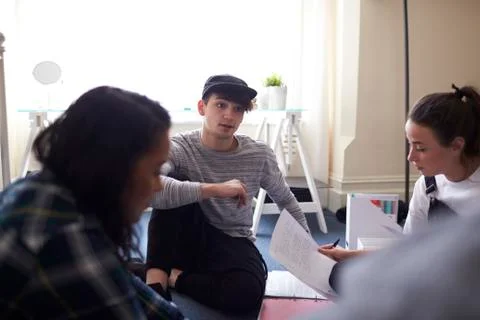 Group Of Students Collaborating On Project Together Stock Photos