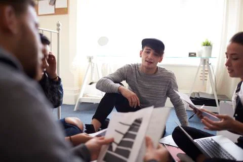 Group Of Students Collaborating On Project Together Stock Photos