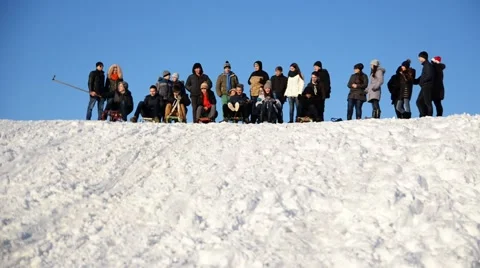 Group of students coming down the hill on a sled. Stock Footage 45997752