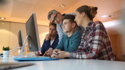 Group of students in computing class with teacher Stock Footage 86521279