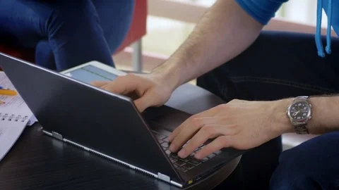 Group of students considering different ideas for a project at the university Stock Footage 75554558