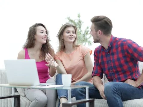 Group of students to discuss the problem sitting on the couch. Stock Photos