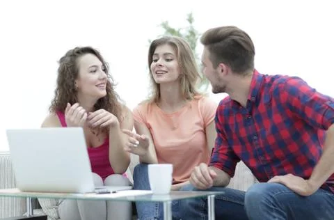 Group of students to discuss the problem sitting on the couch. Stock Photos