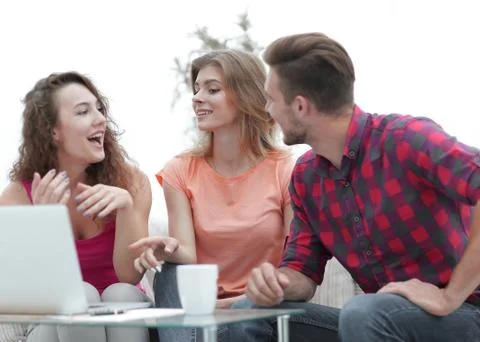 Group of students to discuss the problem sitting on the couch. Stock Photos