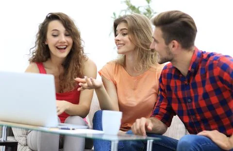 Group of students to discuss the problem sitting on the couch. Stock Photos