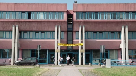 Group of students go into university Stock Footage 77293897