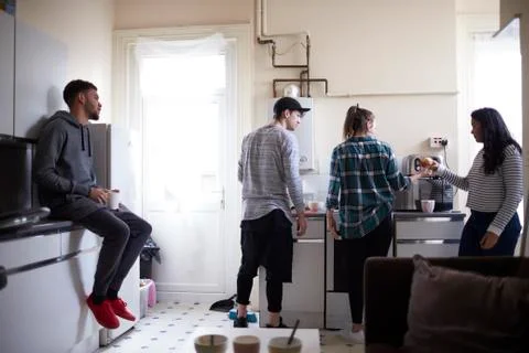 Group Of Students Hanging Out In Shared House Together Stock Photos