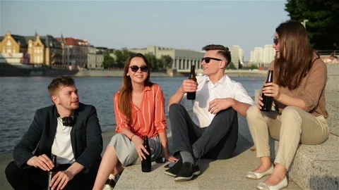 A Group Of Students Having Fun Outdoors. They Are Drinking Beer, Talking To Each Stock Footage 111767699