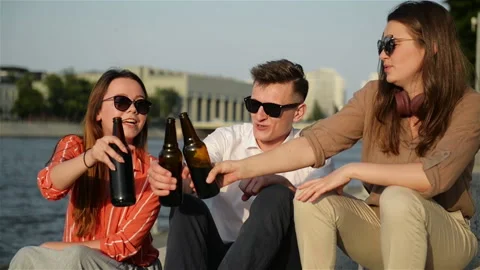 A Group Of Students Having Fun Outdoors. They Are Drinking Beer, Talking To Each Video stock 111771364