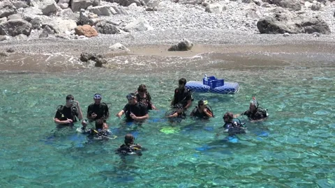 Group of students having scuba diving practice courses in soundings Stock Footage 137812350