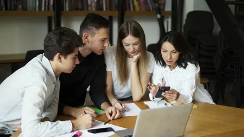 Group of students, high school pupils gather in college library, discuss topics Stock Footage 209899255
