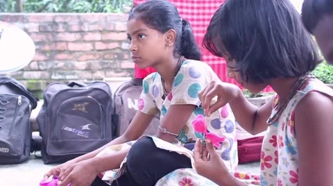 A group of students in India make paper flowers Stock Footage 58810836