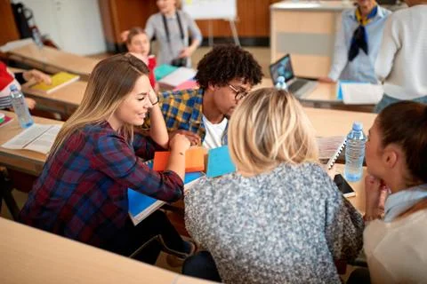 Group of students learning in classroom. Stock Photos