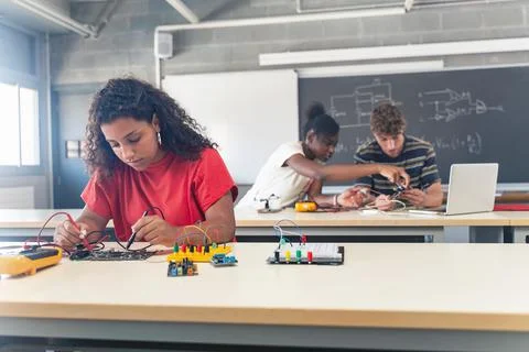 Group of students learning electronics and robotics at High School College Stock Photos