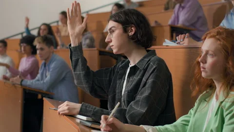 Group of students learns at institute lecture room. Young people study in univer Stock Footage 199483958