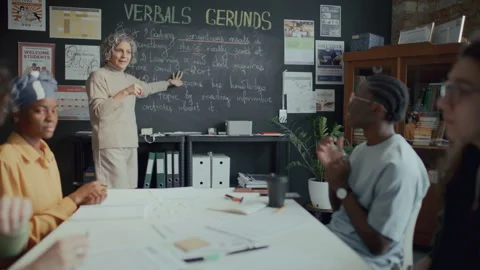 Group of Students Listening to Teacher Explaining English Grammar Lesson Stock Footage 295831809