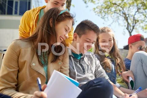 Group of students with notebooks at school yard Stock Photos