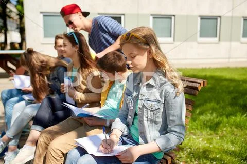 Group of students with notebooks at school yard Stock Photos