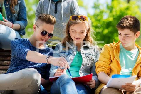Group of students with notebooks at school yard Stock Photos