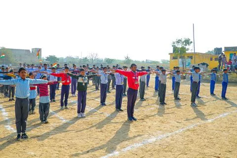 Group of Students Performing Exercises Together on School Campus Stock Photos