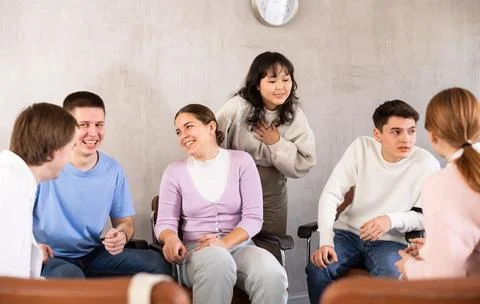 Group of students preparing for exam together in classroom of college Stock Photos
