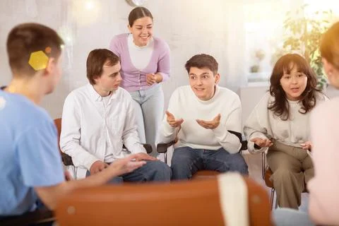Group of students preparing for exam together in classroom of college Stock Photos