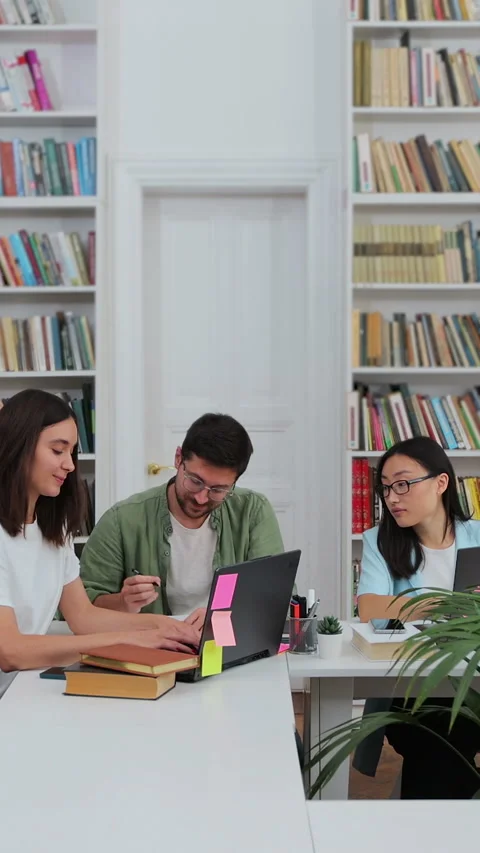 Group of students preparing for exam in university library. Stock Footage 345144223