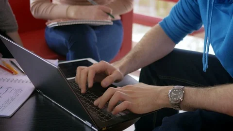 Group of students preparing for a presentation at the university Stock-Footage 75554713