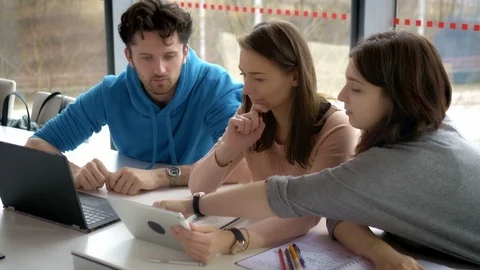 Group of students preparing for a presentation at the university Stock Footage 75554769