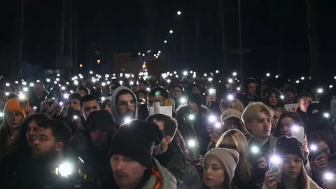 A group of students at a protest. People with lights on their phones. Stock Footage 301881365