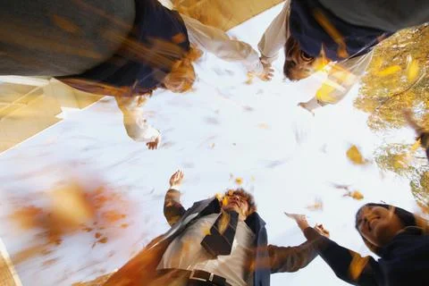 Group Of Students Reaching For Sky Stock Photos