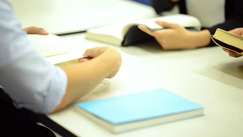 Group of students reading books in library. Stock Footage 85668371