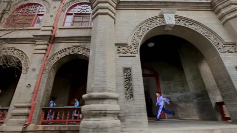A group of students running in the corridor of the school, Beijing, China Stock Footage 143291406