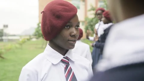 Group of students in school campus discussing and  walking together Stock Footage 252364315