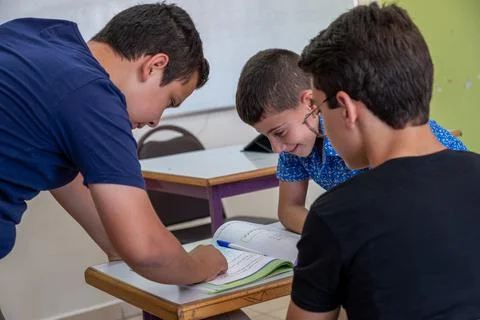 Group of students in school having discussion about some studying fields Stock Photos