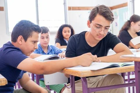 Group of students in school having discussion about some studying fields Stock Photos