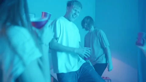 Group of students singing and dancing at home, teenagers having party during Stock Footage 154372545