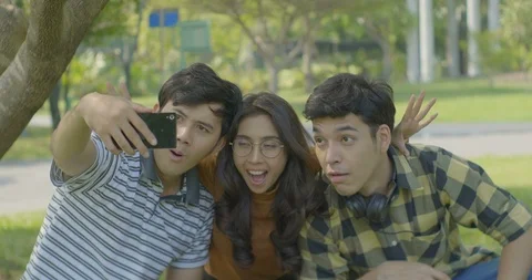 Group of students sitting in the park. Stock Footage 86019209