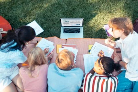 Group of students solving problems from the laptop. 스톡 사진