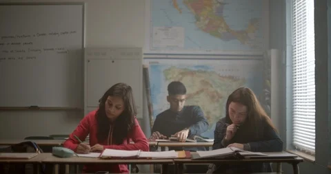 Group of students study in class together studying for an exam Stock Footage 118141616